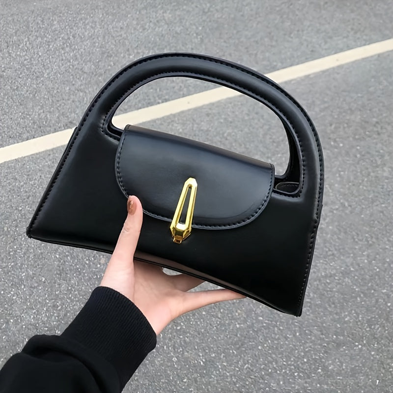 Black satchel bag with a metal button
