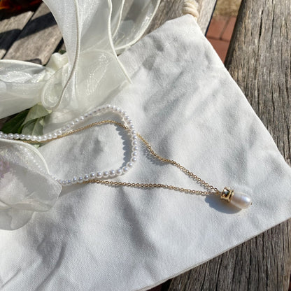 Elegantes geschichtetes Set aus Perlenketten 
